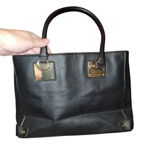 Mossimo black shoulder bag with gold accents. A lot of pockets, zippers, clean